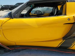 2005 Lotus Elise z VIN SCCPC11105HL30103, wystawiony jako Copart lot #87713445 z przebiegiem Nie podano mil oraz Szkody całkowita. Historia ofert i sprzedaży dostępna na DreamBid. Obrazek 7.
