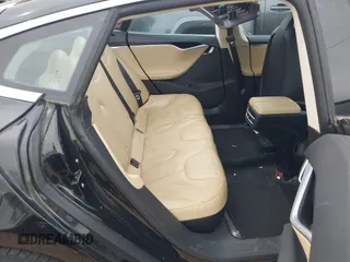 2014 Tesla Model S 60 z VIN 5YJSA1H10EFP34137, wystawiony jako IAAI lot #42311565 z przebiegiem Nie podano mil oraz . Historia ofert i sprzedaży dostępna na DreamBid. Obrazek 8.