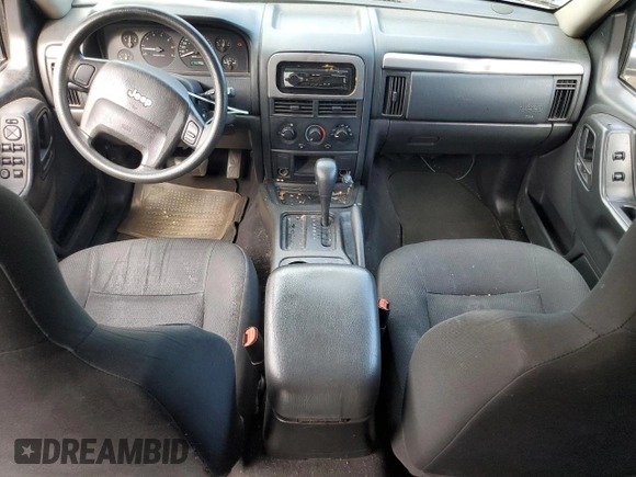 2004 Jeep Grand Cherokee Laredo with VIN 1J4GX48S24C216941, listed as a Copart auction lot 55584785 with 279,710 mi miles and Salvage title. Bid and sale history available at DreamBid. Image 8.