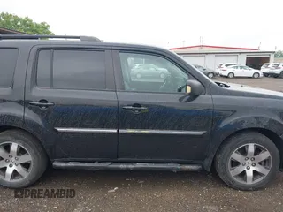 2012 Honda Pilot Touring z VIN 5FNYF4H92CB074778, wystawiony jako IAAI lot #42267913 z przebiegiem 138 362 mil mil oraz . Historia ofert i sprzedaży dostępna na DreamBid. Obrazek 13.
