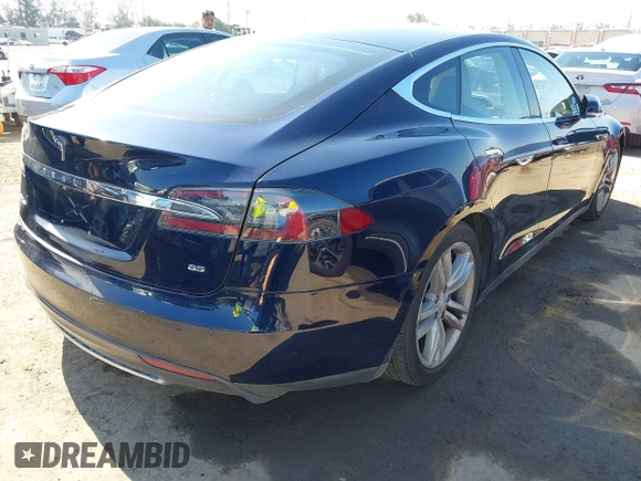 2013 Tesla Model S with VIN 5YJSA1CNXDFP28192, listed as a IAAI auction lot 42227521 with 60,967 mi miles and . Bid and sale history available at DreamBid. Image 4.