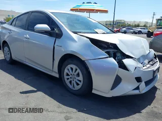 2016 Toyota Prius Two z VIN JTDKBRFU7G3024287, wystawiony jako IAAI lot #42087342 z przebiegiem 126 289 mil mil oraz . Historia ofert i sprzedaży dostępna na DreamBid. Obrazek 1.