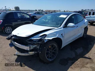 2023 Tesla Model 3 with VIN 5YJ3E1EA2PF571569, listed as a IAAI auction lot 42288715 with 30,271 mi miles and . Bid and sale history available at DreamBid. Image 6.