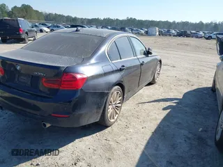 2014 BMW 3 Series 335i with VIN WBA3A9C54EF477943, listed as a IAAI auction lot 41632554 with 102,273 mi miles. Bid and sale history available at carsss.com. Image 4.