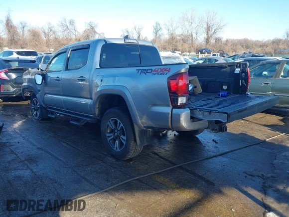 2018 Toyota Tacoma SR with VIN 5TFCZ5AN3JX151479, listed as a IAAI auction lot 41428376 with 104,717 mi miles. Bid and sale history available at carsss.com. Image 3.
