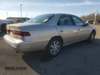 1999 Toyota Camry LE z VIN JT2BF22K4X0199123, wystawiony jako Copart lot #53456665 z przebiegiem 181 526 mil mil oraz Szkoda całkowita • Salvage title. Historia ofert i sprzedaży dostępna na DreamBid. Obrazek 3.