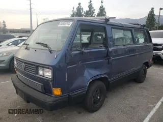 1990 Volkswagen Vanagon with VIN WV2YB025XLH025727, listed as a Copart auction lot 84563744 with 184,748 mi miles and Salvage Title. Bid and sale history available at DreamBid. Image 1.
