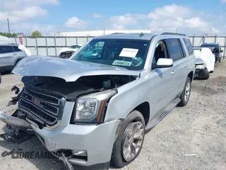 2015 GMC Yukon SLT z VIN 1GKS2BKC0FR100064, wystawiony jako IAAI lot #41941462 z przebiegiem 136 740 mil mil oraz . Historia ofert i sprzedaży dostępna na DreamBid. Obrazek 6.