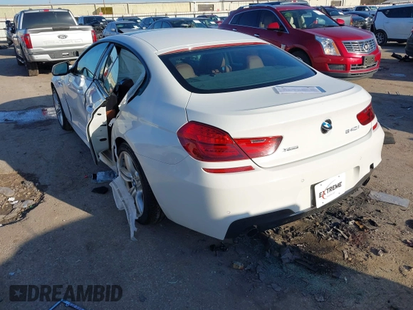 2015 BMW 6 Series 640i xDrive with VIN WBA6B8C50FD453317, listed as a IAAI auction lot 41635430 with 77,811 mi miles and . Bid and sale history available at DreamBid. Image 3.