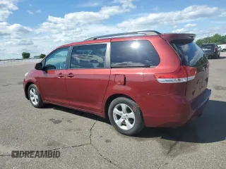 2012 Toyota Sienna LE AAS with VIN 5TDKK3DC7CS195590, listed as a Copart auction lot 57968415 with 201,732 mi miles and Salvage title. Bid and sale history available at DreamBid. Image 2.