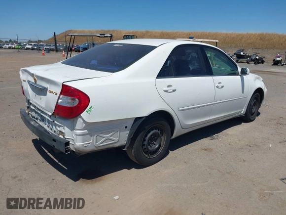 2002 Toyota Camry LE z VIN 4T1BE32K82U038819, wystawiony jako IAAI lot #42301111 z przebiegiem 189 166 mil mil oraz . Historia ofert i sprzedaży dostępna na DreamBid. Obrazek 4.