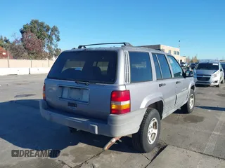 1996 Jeep Grand Cherokee Laredo with VIN 1J4FX58S8TC169575, listed as a IAAI auction lot 40971134 with 152,116 mi miles. Bid and sale history available at carsss.com. Image 4.