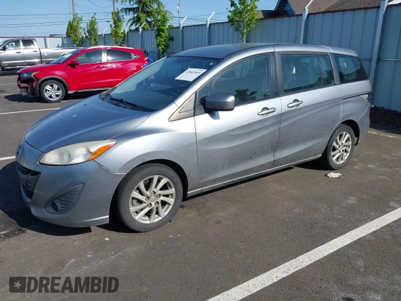 2012 Mazda 5 Sport z VIN JM1CW2BL3C0115906, wystawiony jako IAAI lot #42062899 z przebiegiem 124 286 mil mil oraz . Historia ofert i sprzedaży dostępna na DreamBid. Obrazek 2.