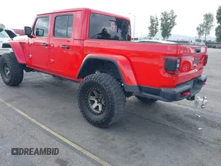 2021 Jeep Gladiator Rubicon with VIN 1C6JJTBGXML572976, listed as a IAAI auction lot 42134909 with 35,612 mi miles and . Bid and sale history available at DreamBid. Image 3.