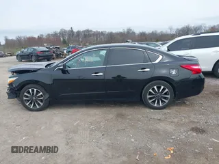 2016 Nissan Altima SR with VIN 1N4AL3AP1GC128738, listed as a IAAI auction lot 41948182 with 156,880 mi miles and . Bid and sale history available at DreamBid. Image 14.