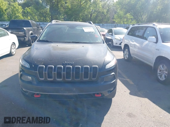 2015 Jeep Cherokee Trailhawk with VIN 1C4PJMBS4FW556822, listed as a IAAI auction lot 42412874 with 129,865 mi miles and . Bid and sale history available at DreamBid. Image 6.