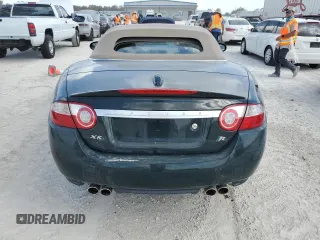 2007 Jaguar XK with VIN SAJWA44C779B12243, listed as a Copart auction lot 77239534 with 0 mi miles and Salvage Title. Bid and sale history available at carsss.com. Image 6.