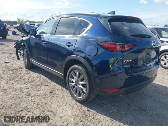 2021 Mazda CX-5 Grand Touring with VIN JM3KFADM0M0469886, listed as a IAAI auction lot 41617270 with 33,571 mi miles. Bid and sale history available at carsss.com. Image 3.