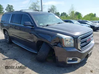 2015 GMC Yukon XL SLT z VIN 1GKS2HKCXFR288675, wystawiony jako IAAI lot #42191515 z przebiegiem 145 307 mil mil oraz . Historia ofert i sprzedaży dostępna na DreamBid. Obrazek 1.
