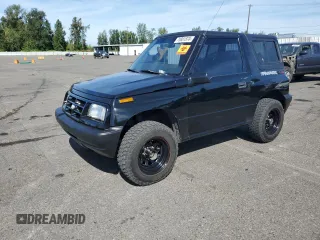 1998 Chevrolet Tracker z VIN 2CNBJ1868W6925819, wystawiony jako Copart lot #70881874 z przebiegiem 180 849 mil mil oraz Szkoda całkowita • Salvage title. Historia ofert i sprzedaży dostępna na DreamBid. Obrazek 1.