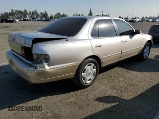 1995 Toyota Camry LE with VIN JT2GK12E7S0107467, listed as a Copart auction lot 83491534 with 112,971 mi miles and Salvage Title. Bid and sale history available at carsss.com. Image 3.