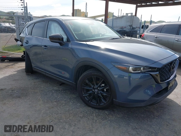 2023 Mazda CX-5 2.5 S Carbon Edition with VIN JM3KFBCM9P0240506, listed as a IAAI auction lot 41583703 with 23,173 mi miles. Bid and sale history available at carsss.com. Image 1.
