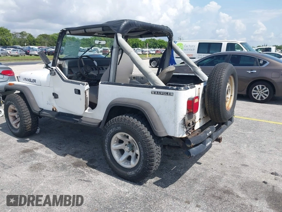 1990 Jeep Wrangler with VIN 2J4FY29T7LJ528844, listed as a IAAI auction lot 42354175 with 69,349 mi miles and . Bid and sale history available at DreamBid. Image 3.