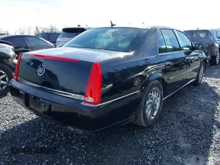 2006 Cadillac DTS 1SC z VIN 1G6KD57YX6U100634, wystawiony jako IAAI lot #41671007 z przebiegiem Nie podano mil oraz . Historia ofert i sprzedaży dostępna na DreamBid. Obrazek 4.