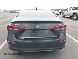 2022 Honda Civic Sport z VIN 2HGFE2F51NH597755, wystawiony jako IAAI lot #42006031 z przebiegiem 33 511 mil mil oraz . Historia ofert i sprzedaży dostępna na DreamBid. Obrazek 16.