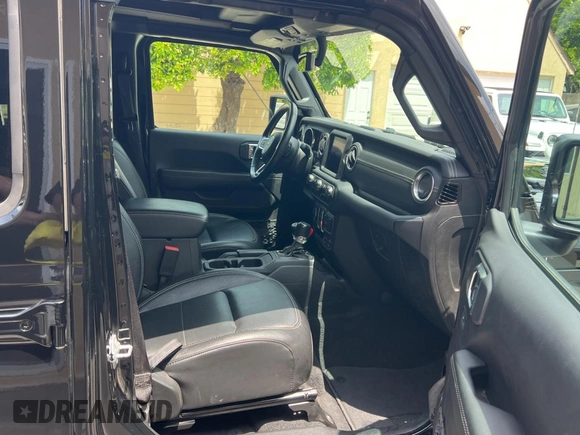 2023 Jeep Wrangler Sahara with VIN 1C4JJXP65PW627241, listed as a Copart auction lot 55661585 with 9,282 mi miles and Clean Title. Bid and sale history available at DreamBid. Image 5.