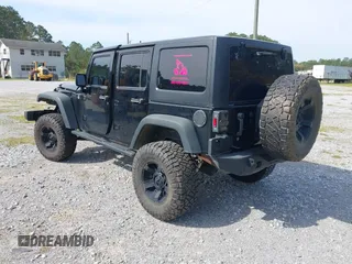 2012 Jeep Wrangler Unlimited Sport with VIN 1C4BJWDG2CL258264, listed as a IAAI auction lot 41880235 with 173,661 mi miles. Bid and sale history available at carsss.com. Image 3.