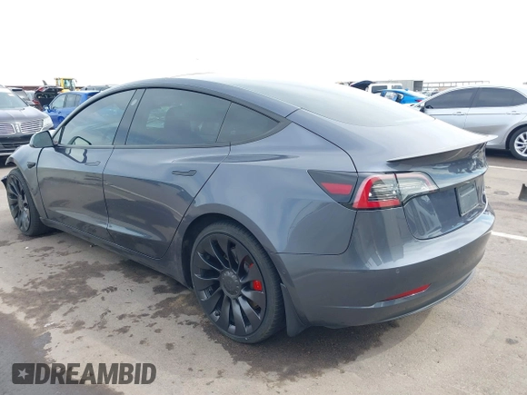2022 Tesla Model 3 Performance with VIN 5YJ3E1EC3NF296891, listed as a IAAI auction lot 41808329 with 82,682 mi miles and . Bid and sale history available at DreamBid. Image 3.