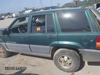1996 Jeep Grand Cherokee Laredo with VIN 1J4FX58S9TC300710, listed as a IAAI auction lot 42073391 with 1 mi miles. Bid and sale history available at carsss.com. Image 14.