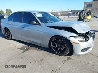 2015 BMW 3 Series 328i with VIN WBA3A5C57FF609054, listed as a IAAI auction lot 41330498 with 129,378 mi miles. Bid and sale history available at carsss.com. Image 1.