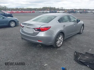 2014 Mazda 6 i Touring with VIN JM1GJ1V64E1147549, listed as a IAAI auction lot 42041025 with 124,400 mi miles and . Bid and sale history available at DreamBid. Image 4.