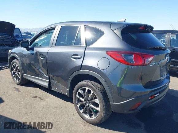 2016 Mazda CX-5 Grand Touring z VIN JM3KE2DYXG0649781, wystawiony jako IAAI lot #41636329 z przebiegiem 83 433 mil mil oraz . Historia ofert i sprzedaży dostępna na DreamBid. Obrazek 3.