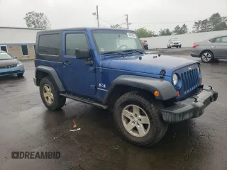 2009 Jeep Wrangler X with VIN 1J4FA24109L712701, listed as a Copart auction lot 60800855 with 156,709 mi miles and Salvage title. Bid and sale history available at DreamBid. Image 4.