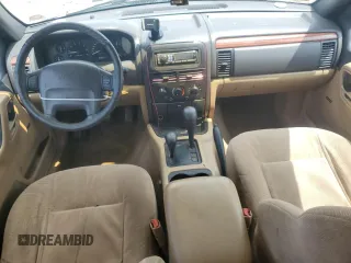 1999 Jeep Grand Cherokee Laredo with VIN 1J4GW58N7XC799434, listed as a Copart auction lot 64790905 with 272,384 mi miles and Salvage title. Bid and sale history available at DreamBid. Image 8.