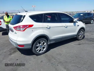 2013 Ford Escape SEL with VIN 1FMCU0HX1DUB99590, listed as a IAAI auction lot 41987910 with 129,954 mi miles. Bid and sale history available at carsss.com. Image 4.