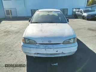 1997 Hyundai Accent z VIN KMHVF24NXVU373676, wystawiony jako Copart lot #77866484 z przebiegiem 151 949 mil mil oraz Tytuł czysty. Historia ofert i sprzedaży dostępna na DreamBid. Obrazek 5.
