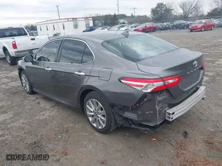 2020 Toyota Camry LE with VIN 4T1C11AK0LU400052, listed as a IAAI auction lot 41861392 with 69,341 mi miles. Bid and sale history available at carsss.com. Image 3.