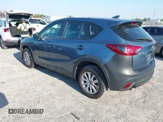 2016 Mazda CX-5 Sport with VIN JM3KE2BY8G0864983, listed as a IAAI auction lot 42072385 with 141,104 mi miles. Bid and sale history available at carsss.com. Image 3.