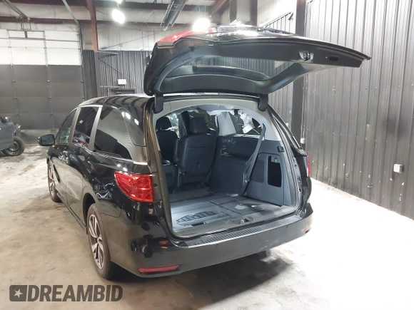 2021 Honda Odyssey Touring with VIN 5FNRL6H83MB040138, listed as a IAAI auction lot 39150096 with 61,322 mi miles and . Bid and sale history available at DreamBid. Image 3.