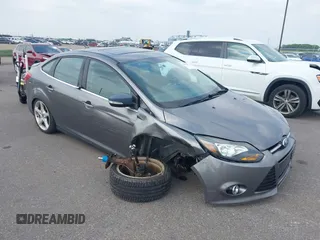 2014 Ford Focus Titanium with VIN 1FADP3J21EL149561, listed as a IAAI auction lot 42460489 with 79,714 mi miles and . Bid and sale history available at DreamBid. Image 1.