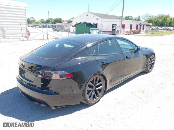 2021 Tesla Model S Plaid with VIN 5YJSA1E66MF452258, listed as a IAAI auction lot 41832000 with 42,845 mi miles. Bid and sale history available at carsss.com. Image 4.