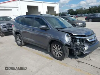 2020 Honda Pilot EX-L with VIN 5FNYF5H59LB014497, listed as a IAAI auction lot 41527415 with 66,625 mi miles. Bid and sale history available at carsss.com. Image 1.
