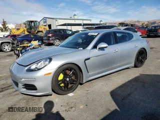2015 Porsche Panamera S E-Hybrid z VIN WP0AD2A79FL040956, wystawiony jako Copart lot #80707944 z przebiegiem 74 001 mil mil oraz Tytuł czysty. Historia ofert i sprzedaży dostępna na DreamBid. Obrazek 1.
