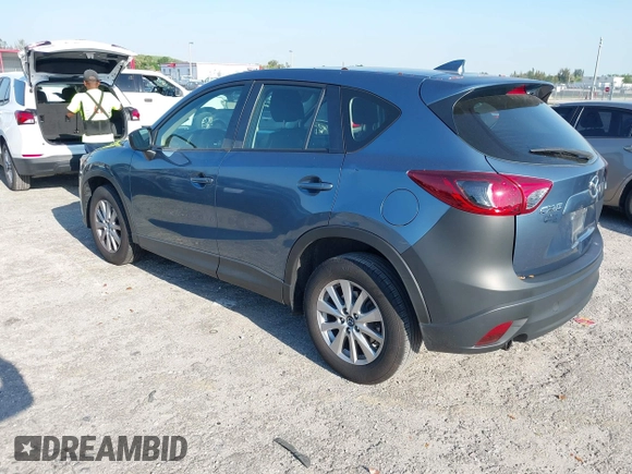 2016 Mazda CX-5 Sport with VIN JM3KE2BY8G0864983, listed as a IAAI auction lot 42072385 with 141,104 mi miles. Bid and sale history available at carsss.com. Image 3.