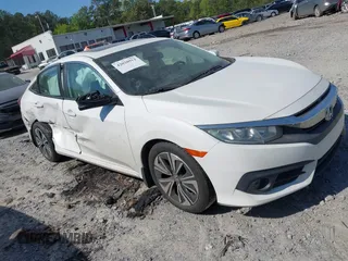 2018 Honda Civic EX-L z VIN 19XFC1F70JE000634, wystawiony jako IAAI lot #42020912 z przebiegiem 156 030 mil mil oraz . Historia ofert i sprzedaży dostępna na DreamBid. Obrazek 1.