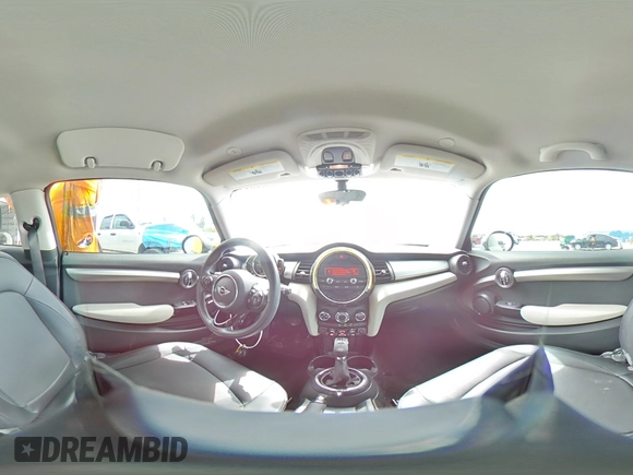 2014 MINI Hardtop with VIN WMWXM5C51ET934047, listed as a Copart auction lot 63039335 with 104,446 mi miles and Salvage title. Bid and sale history available at DreamBid. Image 16.